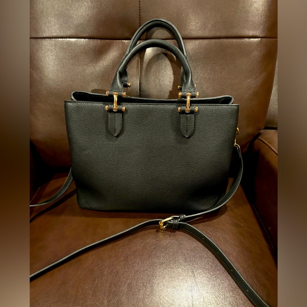 Miztique purse. Black with gold hardware. Excellent condition